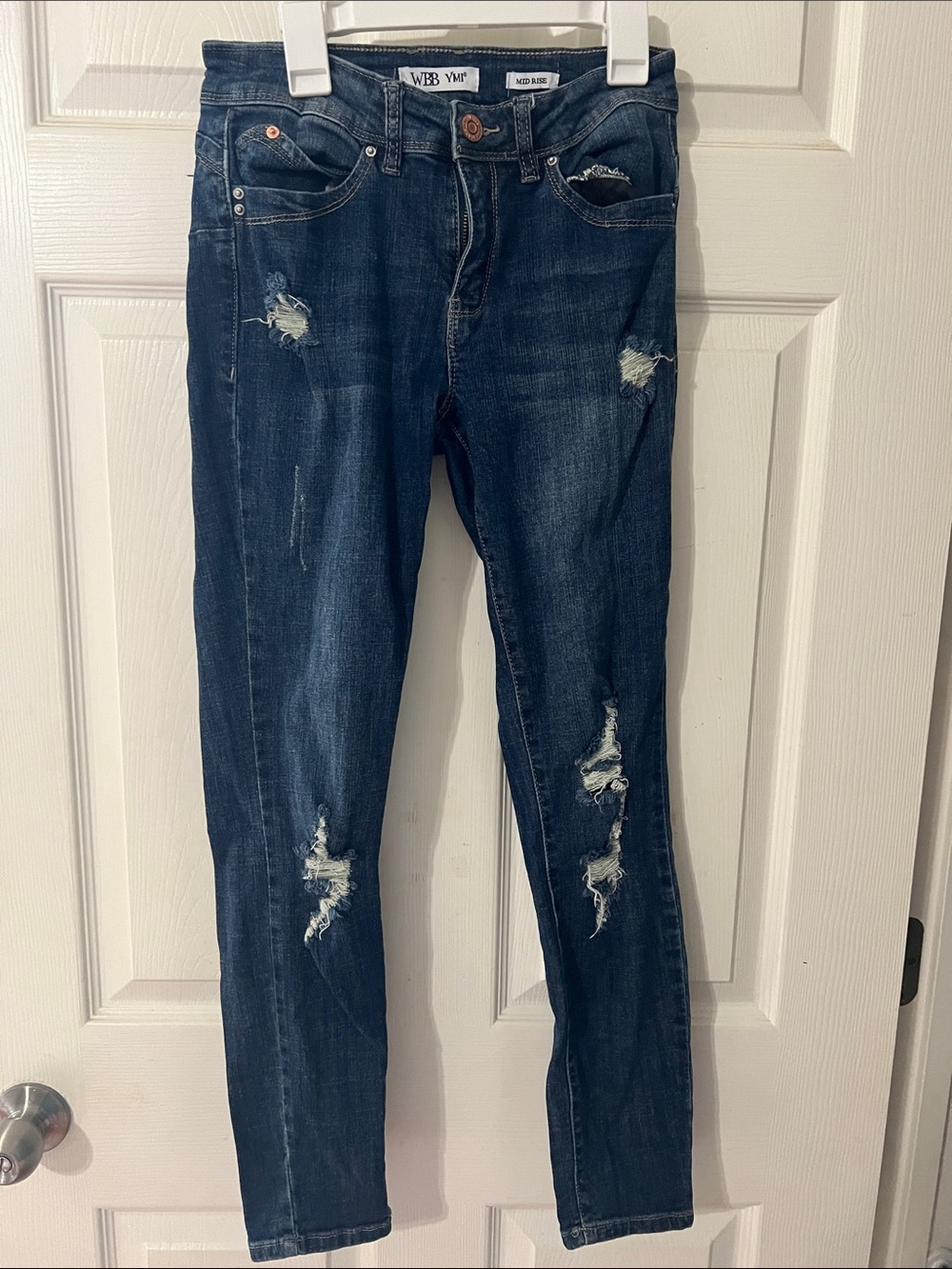 Vintage Women’s Skinny Distressed Jeans in Dark Blue